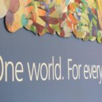 blue wall that reads "One world. For everyone." in white text
