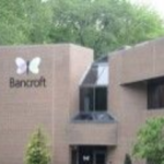 Bancroft headquarters; a brown two-story building with a large Bancroft logo
