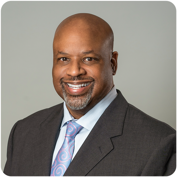 Bancroft's Chief Legal Officer James Wellons smiling in his headshot while wearing a suit and tie