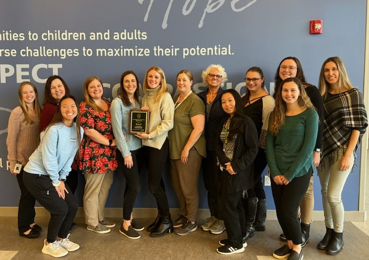 A group of occupational therapists pose for a picture.