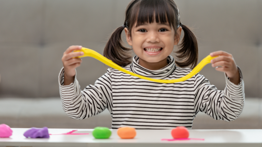 Little girl playing with Playdoh