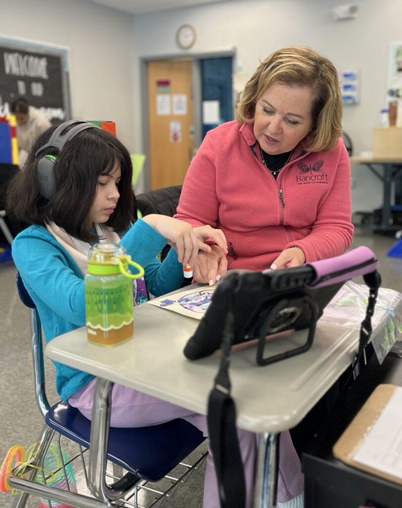 Prinicipal Lisa Scarangelli with a female elementary school student