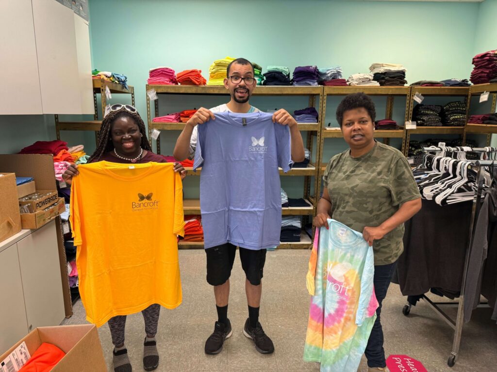 3 Employees working at Shop Bancroft printing shirts