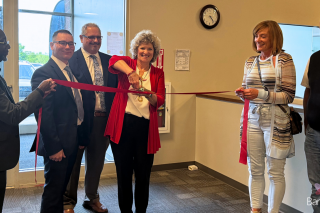 Ceremonial cutting of the ribbon at the new facility