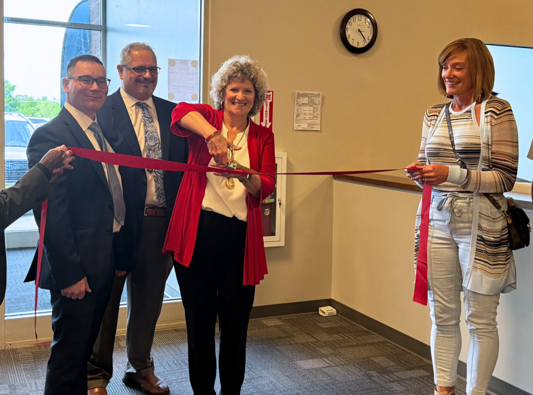 Ceremonial cutting of the ribbon at the new facility