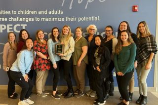 A group of occupational therapists pose for a picture.
