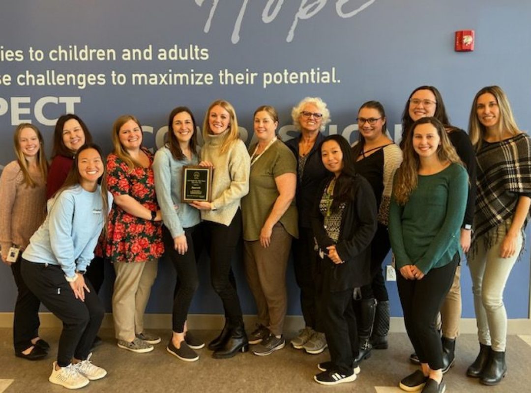 A group of occupational therapists pose for a picture.