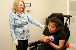 Bancroft Nurse with female patient using a wheelchair